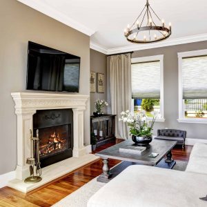 Custom fireplace mantle and wood trim in living room from Shelby Township woodworking company, FIX-IT